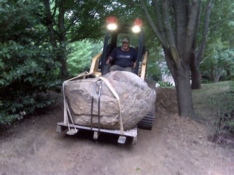 skid steer for moving rocks|how to move large rocks.